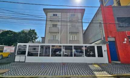 Kitnet no Boqueirão com área de serviço pertinho da praia por 215.000,00