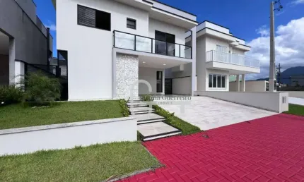 Casa com 4 dormitórios à venda, 193 m² por R$ 1.670.000,00 - Condomínio Flora Rica - Peruíbe/SP