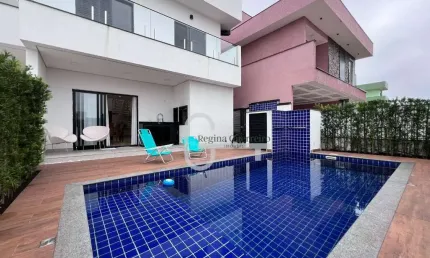 Casa com 4 dormitórios à venda, 207 m² por R$ 1.450.000,00 - Condomínio Flora Rica - Peruíbe/SP