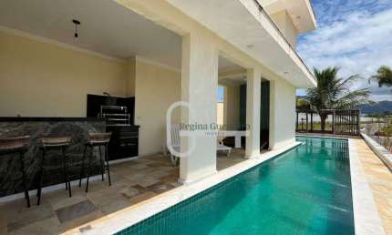 Casa com 4 dormitórios à venda, 518 m² por R$ 3.500.000,00 - Condomínio Flora Rica - Peruíbe/SP
