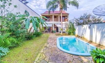 Casa com 4 quartos à venda na Rua Chile, 882, Petrópolis, Porto Alegre, 417 m2 por R$ 1.690.000