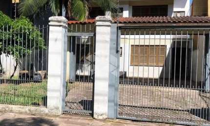 Casa com 5 quartos à venda na Rua Márcio Dias, 290, Nonoai, Porto Alegre por R$ 750.000