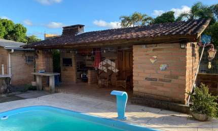 Casa com 4 quartos à venda na Artur Antônio Da Silva, 117, Araça, Capão da Canoa por R$ 532.000