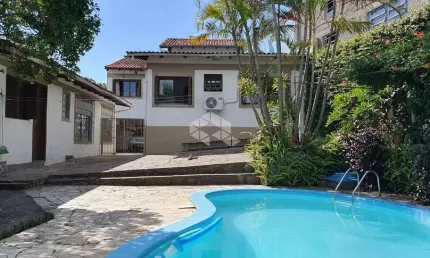 Casa com 4 quartos à venda na Rua Primeiro de Maio, 42, Partenon, Porto Alegre por R$ 1.330.000