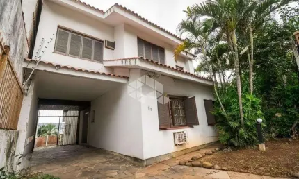 Casa com 5 quartos à venda na Rua Palestina, 53, Bom Jesus, Porto Alegre por R$ 1.170.000