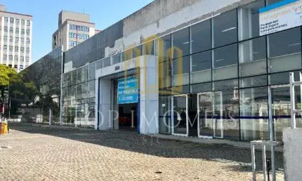 Predio comercial ampla area de salao e estacionamento areas de escritorios e banheiros