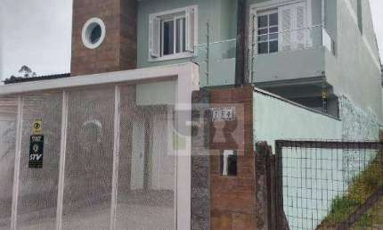 Ótimo sobrado com 3 dormitórios sendo 2 suítes á venda no bairro Moradas do Bosque em Cachoeirinha RS.