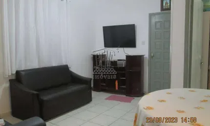 Apartamento com 1 dormitório, sala, cozinha e área de serviço.