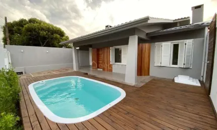 Casa em condomínio fechado com 3 quartos à venda na Rua Rio Douradinho, 2409, Centro, Xangri-Lá por R$ 1.190.000