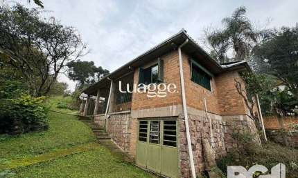 Casa com 3 quartos à venda na Rua dos Canudos, 358, Cascata, Porto Alegre