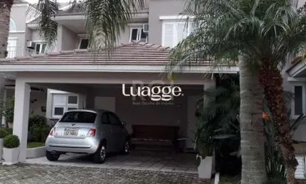 Casa em condomínio fechado, às margens do rio guaíba,