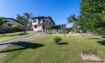 Casa com 3 quartos à venda na Rua Flor de Pessegueiro, 202, Vila Nova, Porto Alegre