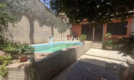 Casa com 4 quartos à venda na Rua Laguna, 181, Cavalhada, Porto Alegre