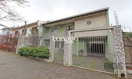 Casa com 5 suítes, 7 banheiros, 4 vagas no bairro Partenon