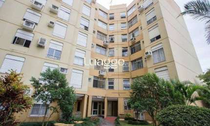 Apartamento de 1 dormitório, living, cozinha, área de serviço e banheiro social.