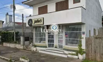 Apartamento de frente com 1 dormitório, sala, cozinha e sacada.