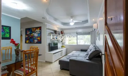 Apartamento de 2 quartos, living, cozinha planejada, área de serviço e 1 vaga.