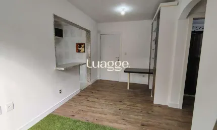 Apartamento de 1 dormitório, living, cozinha planejada, banheiro social.