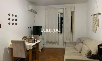 Apartamento de 2 dormitórios, living, cozinha, área de serviço e banheiro social.