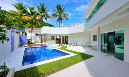 Linda casa com 5 suítes em condomínio fechado de alto padrão na praia de Pernambuco no Guarujá!
