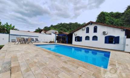 Casa com 4 dormitórios à venda, 300 m² por R$ 1.300.000,00 - Massaguaçu - Caraguatatuba/SP