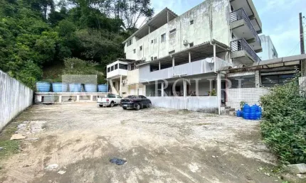 Terreno no guarujá, enseada, área de estacionamento e hotel