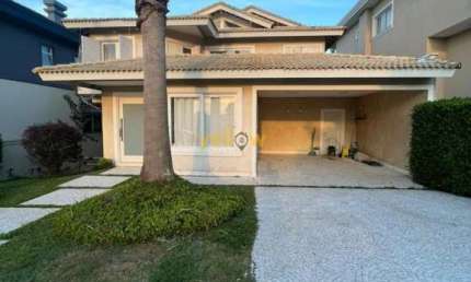 Casa em Condomínio Fechado em Alphaville com 580m², 4 suítes e 5 banheiros - Venda e Locação por R$3.950.000