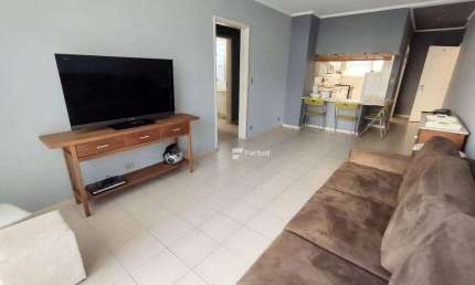 Frente mar, 2 dormitórios à venda, 110 m² por R$ 500.000 - Pitangueiras - Guarujá/SP