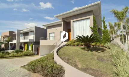 Casa em condômino com 6 suítes, área gourmet e 4 vagas de garagem!