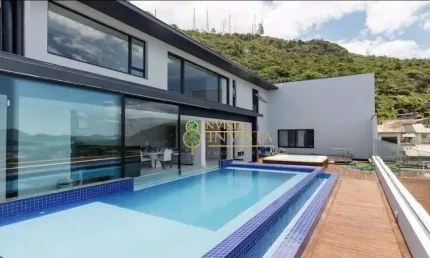 Varanda gourmet com piscina e jacuzzi, vista Mar e 4 quartos - À venda próximo à UFSC na Trindade.
