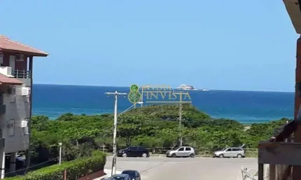 Apartamento com 130m², Vista Mar, sacada com churrasqueira, 3 quartos e 2 vagas de garagem.