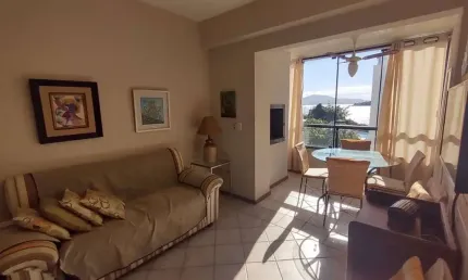 À venda | Pé na Areia, 63 m² 2 quartos, Sacada com churrasqueira e Vista Mar, 1 vaga de garagem - Praia de Canasvieiras, em Florianópolis.