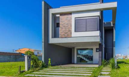 vende sobrado novo em condomínio com 3 suítes em Canoas.