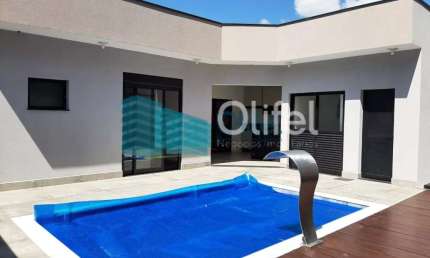 Linda casa térrea, 206m².O imóvel conta com 03 suítes com armários, sendo a suíte master com closet, escritório, lavabo, sala 2 ambientes, cozinha com armários e espaço gourmet com churrasqueira e arm