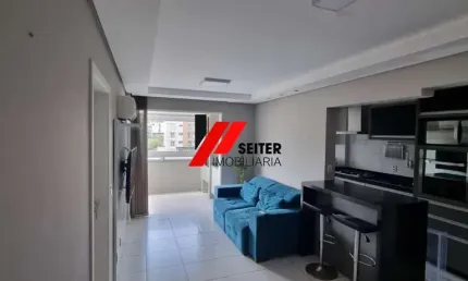 Apartamento semi-mobiliado de 2 dormitorios com suite para locação no Itacorubi