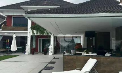 Casa com 4 suítes e lazer privativo em condomínio na barra da tijuca - porteira fechada