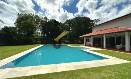 Casa térrea de alto padrão a venda no gramado, 4 suítes com closet e garagem para mais de 15 carros