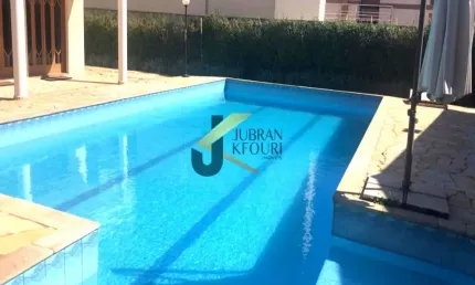 Casa para venda/aluguel no Alphaville Campinas, 5 dormitórios (4 suítes), piscina e garagem para vários carros.