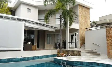 Casa à venda no alphaville campinas, 4 suítes (1 master com varanda), piscina e espaço gourmet
