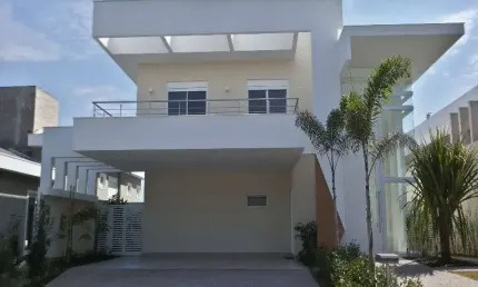 Casa à venda em condomínio na região do alphaville, 4 suítes (3 com closet), piscina e garagem para vários carros