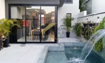 Casa térrea à venda em condomínio - swiss park, com 3 suítes e garagem para vários carros .piscina aquecida com cascata.