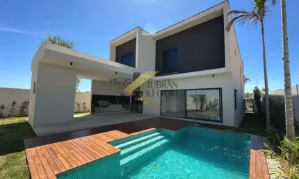 Casa à venda em condomínio - Campinas, com 4 suítes (1 máster), lazer comum e garagem para vários carros.