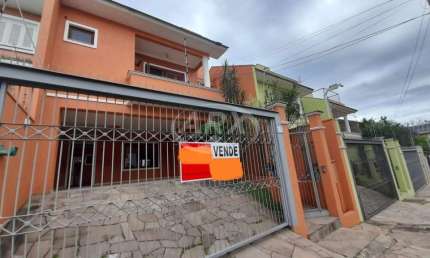Casa com 3 quartos à venda na Rua Bélgica, 65, Marechal Rondon, Canoas por R$ 1.170.000