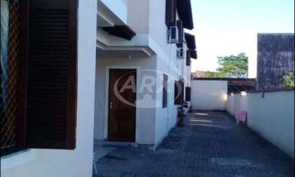 Casa em condomínio fechado com 2 quartos à venda na Rua Sapucaia, 448, Niterói, Canoas por R$ 300.000