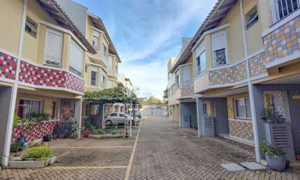 Casa em condomínio fechado com 2 quartos à venda na Rua Antônio Fonseca Barcelos, 200, Marechal Rondon, Canoas, 117 m2 por R$ 430.000