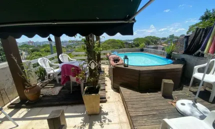 Casa com 3 quartos à venda na Rua Natércia Cunha Veloso, 267, Morro Santana, Porto Alegre, 270 m2 por R$ 798.000