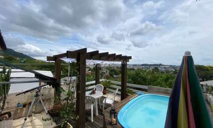 Casa com 3 quartos à venda na Rua Natércia Cunha Veloso, 267, Morro Santana, Porto Alegre, 270 m2 por R$ 798.000