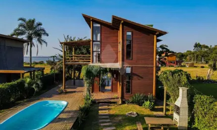Casa em condomínio fechado com 3 quartos à venda na Manoel Irineu Gonçalves, 1, Ibiraquera, Imbituba por R$ 960.000