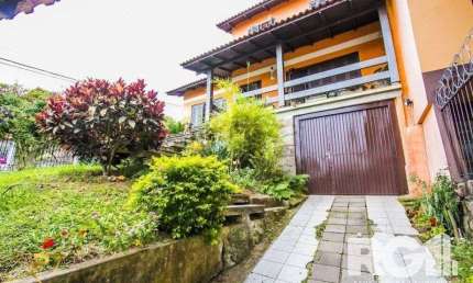 Casa com 5 quartos à venda na Rua Ângelo Passuelo, 79, Vila Nova, Porto Alegre