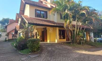 Casa em condomínio fechado com 3 quartos à venda na Rua Luís Felipe Monmany, 101, Espírito Santo, Porto Alegre por R$ 565.000